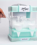 Retro Tabletop Snow Cone Machine With Two Reusable Cups And Sturdy Scoop showing ice inside and two cups ready for serving.