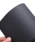 Get That Perfect Finish With These 30 Pcs Waterproof Wet Dry Sanding Sheets Assortment For Auto Body Wood And Metal Polishing Tasks With Custom Trim Sizes, showing a black sanding sheet close-up.