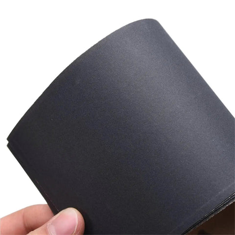 Get That Perfect Finish With These 30 Pcs Waterproof Wet Dry Sanding Sheets Assortment For Auto Body Wood And Metal Polishing Tasks With Custom Trim Sizes, showing a black sanding sheet close-up.
