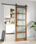 32 By 84 Inch Frosted Glass Barn Door With 5-Panel Design, Waterproof And Scratch-Resistant Surface, shown installed in a modern home