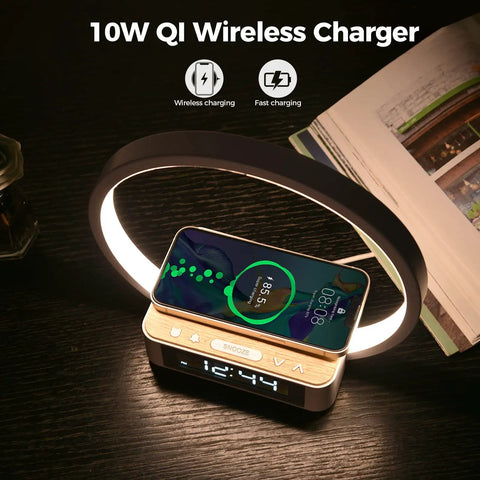 All In One Touch Desk Lamp With Alarm Clock Qi Wireless Charger And Wake Up Light glowing on a dark table