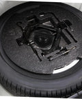 Heavy Duty Tire Bolt Retainer Clamp for Spare Tire Hold Down Fits Most Cars in trunk with tire and fasteners visible
