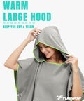 Person wearing a gray Hooded Towel Changing Poncho for Surfing and Outdoor Adventures on the Go Privacy Robe with front kangaroo pocket.