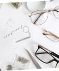Eyeglass Repair Kit With Precision Screwdriver Set Sunglass Screws Replacement Nose Pad Cushions Tweezers And Storage Case For Quick Eyewear Fixes While Traveling, displaying tools, screws, and eyeglasses on a white surface.