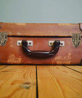 Vintage suitcase with Two Pack Antique Bronze Duckbilled Hasp Clasp Latch Hardware Bronze Toggle Hasp Latches, wooden floor
