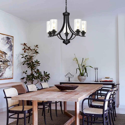 Farmhouse 5-Light Chandelier Pendant Light in black finish with clear glass shades, Classic Empire design over dining table.