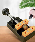 Bench Vice Clamp For Small Parts, Flat Nose Parallel Table Vise in use for jewelry making, black finish, on wooden table.