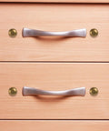 Top Shelf Brass Decorative Screws With Caps For Cabinet Doors And Wood Furniture, showcasing caps beside cabinet handles.