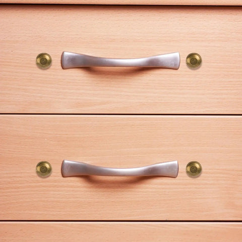 Top Shelf Brass Decorative Screws With Caps For Cabinet Doors And Wood Furniture, showcasing caps beside cabinet handles.