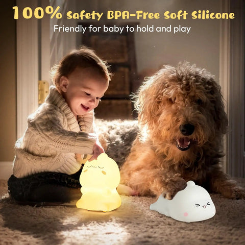 Child playing with Kids Night Light With Remote, 7 Color Kawaii Cat Nursery Lamp, next to a dog, highlighting soft silicone material.