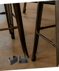 Outdoor Cushion Fasteners 4 Pack Rattan Furniture Clips shown below chair legs on wood floor