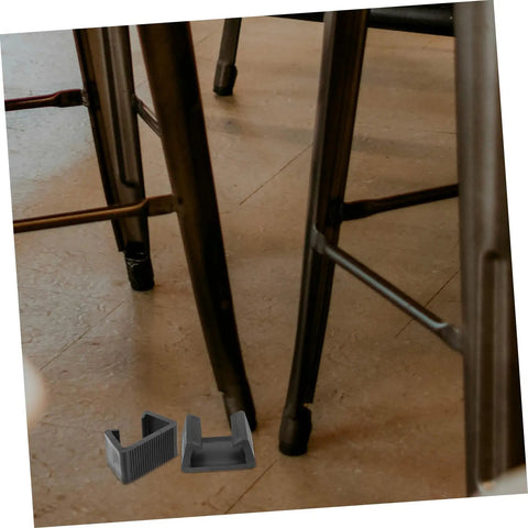 Outdoor Cushion Fasteners 4 Pack Rattan Furniture Clips shown below chair legs on wood floor