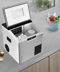2 in 1 Countertop Ice Maker Crushed Ice and Cube Options Serving Chill with Rock Solid Stainless Steel Build and Smart LCD Screen Delivers No Sweat Operation Ideal for Mixology and Creamy Smoothies while Keeping Setup Slick at Social Hangouts, view from above showing ice cubes and drinks.