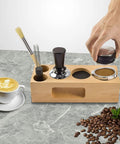 Top Tier Wood Coffee Tamper With Precision Powder Distributor Kit featuring wooden base, tools, and coffee cup.