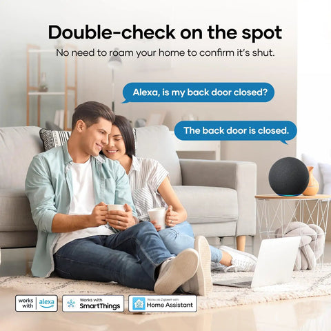 Couple enjoying coffee at home with Zigbee door sensor, checking security via Alexa integration for safety.