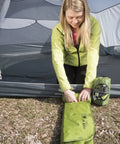 Person setting up Static V2 Dope Inflatable Sleeping Pad For Camping And Backpacking Ultralight Portable Air Bed in a tent