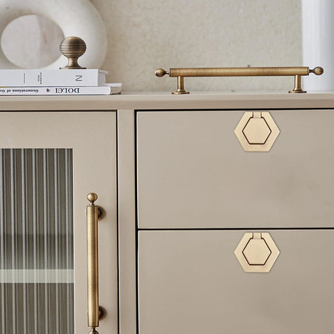 Two Pack Zinc Alloy Flush Mount Cabinet Pull Handles Gold Finish Flat Ring Style installed on beige cabinet