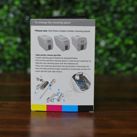 Instructional guide for changing cleaning spools on two pack YMCKO color ribbon for ID badge printers.