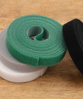 Heavy Duty Reusable Cable Management Straps White Tearable Cord Organizer Tie For Computer Speaker Guitar Wires in green, grey, and black.