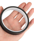 Hand holding High Temperature PTFE Heat Resistant Tape For Heat Transfer Applications, 1 Roll, One Half Inch Wide, Waterproof Black Tape