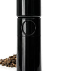 Unicorn Pepper Mill By Tre Spade Premium Kickin Manual Pepper Grinder with steel burrs, 6 inch size, next to peppercorns.