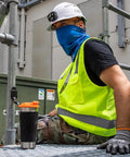 Worker on construction site with Stainless Steel Tumbler With Flip Top Lid 20 Oz Insulated Double Wall Vacuum Mug