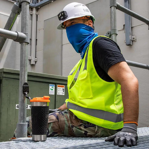Worker on construction site with Stainless Steel Tumbler With Flip Top Lid 20 Oz Insulated Double Wall Vacuum Mug