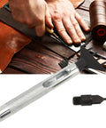 Hands using Leather Chisel Kit With Replaceable Blades And Belt Punch Set on brown leather with tools and accessories visible.