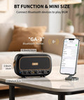 Compact 5W Per Channel Guitar Amp, Portable Battery Powered Practice Speaker With Bluetooth next to smartphone showing connection