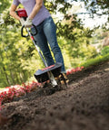 Person using Garden Cultivator Attachment With Four Premium Tines For Attachment Capable String Trimmers Polesaws And Powerheads