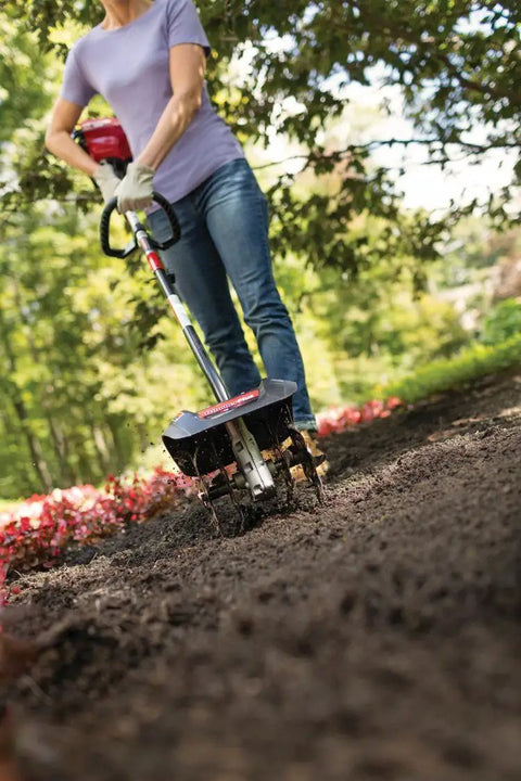 Person using Garden Cultivator Attachment With Four Premium Tines For Attachment Capable String Trimmers Polesaws And Powerheads