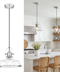 kudos 11 Inch Brushed Nickel Clear Striped Pendant Light, KDPL13-BN-C over a kitchen island with clear glass shade.