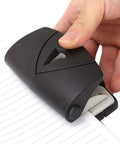 2 Hole Puncher With Positioning Ruler Mini Handheld Black Office Tool for School, punching paper, showing non-slip bottom, 10 sheet capacity