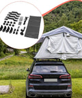 SUV parked with Rooftop Tent Mount Bracket Kit With Quick Release Clamp for roof racks, featuring a tent setup on a grassy field.
