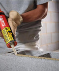 Person applying 3X Stronger Do-It-All Polyurethane Construction Adhesive 10 Oz Cartridge 12 Pack For Wood, Concrete, Stone, Metal And More Versatile Bonding Solution For Indoor And Outdoor Projects to concrete blocks.