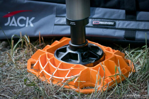 Beefy Heavy Duty Jack Base For Off Road Jacks, 15,400 Lb Load Capacity, Low Profile HDPE Construction on grass.