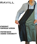 Person wearing Black Waterproof Apron With Two Pockets 35 Inch Heavy Duty Plastic Dishwashing And All Purpose Work Apron