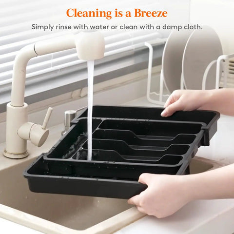 Slick Expandable Silverware Drawer Organizer With Adjustable Dividers For No Sweat Kitchen Storage And Quick Grab Cutlery Access Pretty Darn Spacious Layout Built To Last being rinsed under a faucet.