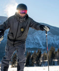 Person skiing with Push To Talk Handheld And Wearable Speaker Microphone Set for GMRS Radios, clear audio, easy clip on jacket