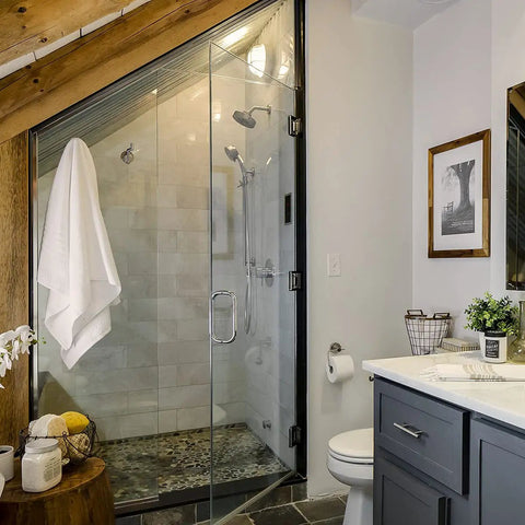 Modern bathroom with Neo Pressure Balance Shower Valve Trim in Brushed Nickel, glass shower enclosure, and towel.