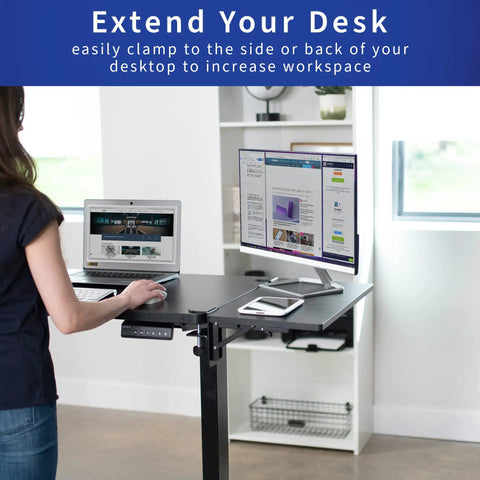 Boss Move Heavy Duty Clamp On Desk Extender With Foldable Keyboard Tray And Padded Wrist Support Expands Workspace For Sit Stand Tables Smooth Setup All Day Grind Black in use with laptop and monitor setup.