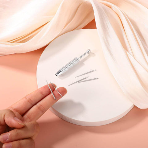 Piercing Ball Grabber Tool For Changing Jewelry Stainless Steel Diamond Claw Tweezers with insertion pins on round platform.