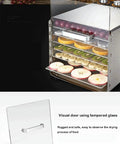 Six Layer Stainless Steel Food Dehydrator A Smooth Operator For Home Or Commercial Kitchens Drying Fruits Vegetables And Homemade Jerky With Efficient Airflow, showing dehydrated fruits on racks.