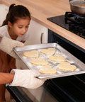 Placing cookies on Six Pack Half Size Aluminum Baking Sheets Set For Oven Roasting PFOA PFOS PTFE Free Bare Aluminum