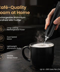 Rechargeable Milk Frother Handheld With Aluminum Body And Stainless Steel Wand, Adjustable Speed, USB C Cable And Stand Included, Delivers Barista Level Foam In Seconds, Ideal Gift For Coffee Lovers frothing milk in black mug.