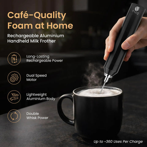 Rechargeable Milk Frother Handheld With Aluminum Body And Stainless Steel Wand, Adjustable Speed, USB C Cable And Stand Included, Delivers Barista Level Foam In Seconds, Ideal Gift For Coffee Lovers frothing milk in black mug.