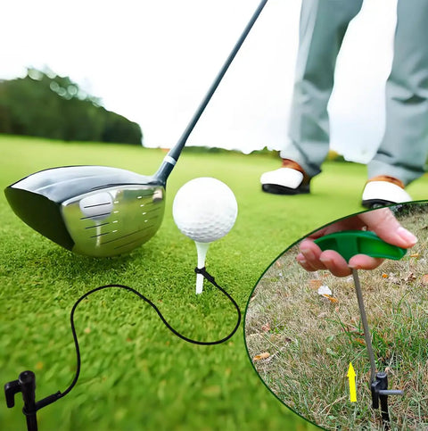 Golf Tee Anchor Kit With 4 Ground Stakes And Durable Bungee Cords Keeps Tees In Place For Consistent Swings No More Lost Tees Includes Stake Puller Tool Perfect For Practice Rounds At The Range Or Backyard Wind Resistant Tee Lock shown in use with driver and ball on grass.