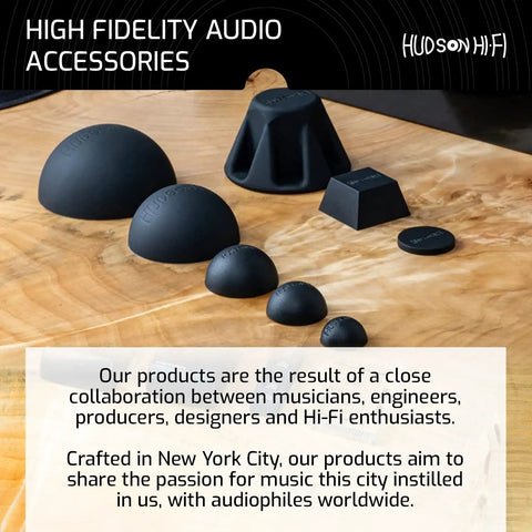 High fidelity audio accessories including 8-Pack 0.75-Inch Platinum Silicone Speaker Isolation Pads and anti-vibration mounts displayed on wood surface.
