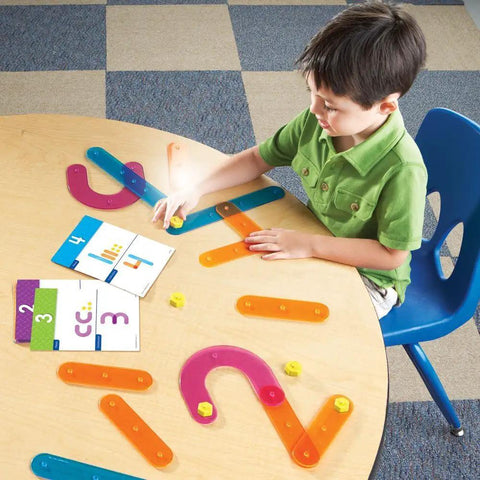 Child playing with Number Construction Kit For Kids 3 Plus With 55 Pieces, Snap Together Color Coded Numbers 0 Through 9 on table.