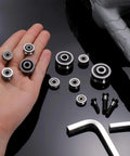 Hand holding 12 Pack Small U Groove Pulley Bearings 4x13x4mm For Rail Track Linear Motion Systems, with tools visible.